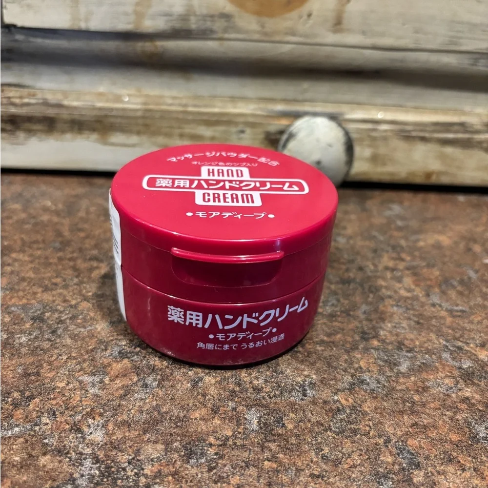 Red Hand Cream Jar